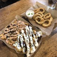 Delicious highlights from the Madrid Vegan Walking Tour: ‘calimari’ rings and patatas sin carne.  at Madrid Vegan Tours in Madrid