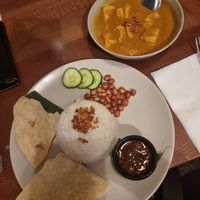 Curry with coconut, pandan, spices with the complimentary rice. Vegan. Tofu cooked separately to meat. at Kuala Lumpur Café in Leeds
