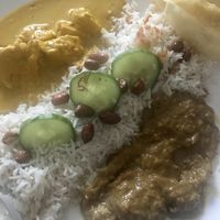 Yellow lime and rendang curries with coconut rice - via Deliveroo  at Kuala Lumpur Café in Leeds