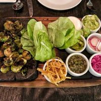 A cross between tacos and Asian lettuce cups, where you rolled your roasted brussel sprouts with your choice of toppings.  The creamy one and the pickled onions were divine. at Dirt Candy in New York City