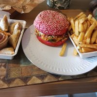 Delivery, fries, kimchi burger, and curry love bites at Vegan Heroes in Eindhoven