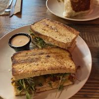 Brunch sandwich on GF bread, Philly burrito in background  at High Note Cafe in Boise