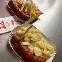 Vegan bratwurst with fries and Bavarian potato salad. Next time, I would go for the fries or bun.  at Curry 36 in Berlin