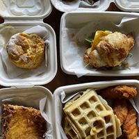 Top left to bottom right: hash brown wedge, honee butter biscuit, wings and waffles, crossaint-wich, s’mores brownie at Verdine in Houston