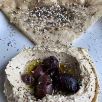Hummus with gluten free pita 💚  at Verdine in Houston