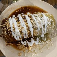 Wet burrito with al pastor and half red sauce half green sauce  at Pancho's Vegan Tacos - Fort Apache in Las Vegas