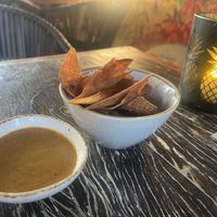 Freshly made tortilla chips with accompanying sweet dipping sauce  at Mosa in Willemstad