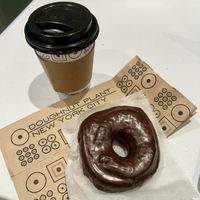 Vegan dark chocolate sourdough donut and oat latte  at Doughnut Plant - Flatbush in Brooklyn