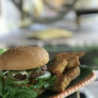 Home made tempeh burger with a side of crispy tempeh at Mama's Garden - Maybe closed in 