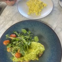 Avo toast with scrambled tofu. Bread super soggy due to watery tofu unfortunately. Had to ask them to give us another plate to avoid the bread getting even soggier   at The Loft - Uluwatu in Pecatu