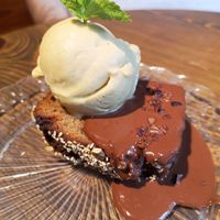Banana bread with chocolate sauce and ice cream at Eqvilibrivm Cafe in Barcelona
