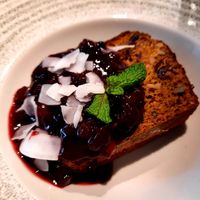 Plum cake with berry sauce at Eqvilibrivm Cafe in Barcelona