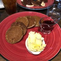 Vegan pancakes, banana and chocolate or maple syrup  at Eqvilibrivm Cafe in Barcelona