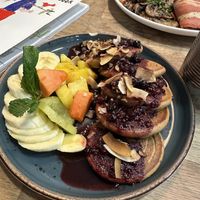 Fresh fruit compote pancakes  at Eqvilibrivm Cafe in Barcelona