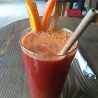 Fresh orange, ginger, carrot, and turmeric juice at Eqvilibrivm Cafe in Barcelona