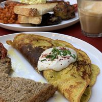 Chickpea omelette and English breakfast with oat lattes  at Eqvilibrivm Cafe in Barcelona