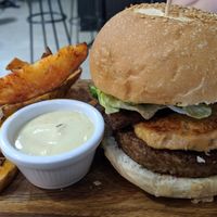The cheese burger with bacon at Eqvilibrivm Cafe in Barcelona