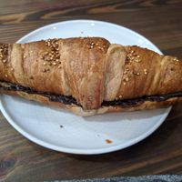 Croissant with dark chocolate filling at Eqvilibrivm Cafe in Barcelona