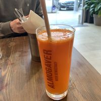 Amazing orange fruit drink with carrot, orange and ginger at Eqvilibrivm Cafe in Barcelona