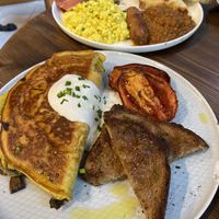 Chickpea omelette and full English breakfast (back) at Eqvilibrivm Cafe in Barcelona