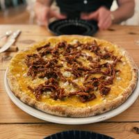 Pizza with a pumpkin base and vegan cheese. P e r f e c t.  at Pisco in Vila Do Bispo