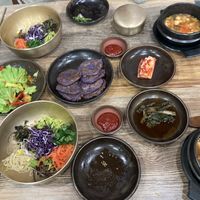 Bibimbap, tofu stew, red cabbage jeon? We just asked for bibimbap and got all of this haha  at Babiboyak in Jeju