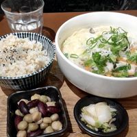 Ramen in pork bone-like soup made of soya-milk. 

You can have noodles on it own.

I order it as a set and it came with a bowl of rice and 2 side dishes.

The whole set was just 1000Y (plus another 80Y for tax). 
 at Mumokuteki Vegan Cafe in Kyoto