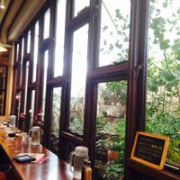 really nice, bright garden view seating. at Mumokuteki Vegan Cafe in Kyoto