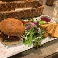 Tofu Burger Set with salad and fried potatoes  at Mumokuteki Vegan Cafe in Kyoto