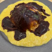 The vegan egg over the tomato rice with gravy !  at Mumokuteki Vegan Cafe in Kyoto