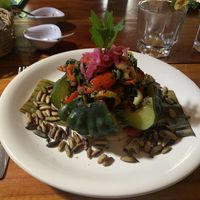 Steamed pumpkin filled with veggies atop rice and a sope at IX CAT IK in Valladolid