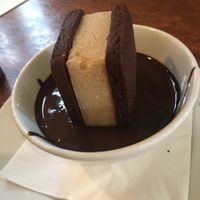 Almond milk ice cream cookie sandwich in chocolate sauce  at Saluté Tapas Restaurant and Bar in Greytown