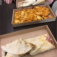 Smoked spicy seitan wrap with fries  at Vegan Kiraly in Budapest
