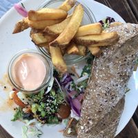Yummi vegan chicken sandwich with fries, mayo and a small salad.  at Café Korn in Roskilde