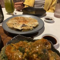 Gyoza and air-fried Broccoli in peanut butter sauce  at PLANTA Queen in Toronto