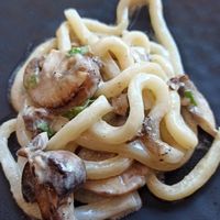 Udon noodles with mushrooms and truffle at PLANTA Queen in Toronto