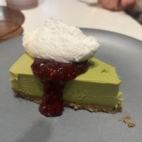 Matcha cheesecake with raspberry coulis and coconut cream  at PLANTA Queen in Toronto