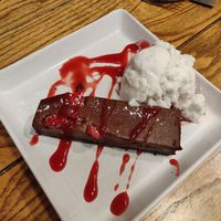 Chocolate & raspberry torte with raspberry coulis & vanilla ice cream at White Cart in Glasgow