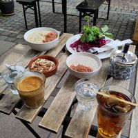Open aubergine sandwich on top right, porridge lacking granola top left, chia dish lacking granola in the moddle at Cafe Sonja in Copenhagen