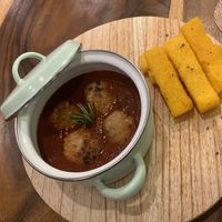 meatballs in tomato sauce and polenta sticks at Amami Garden in Ungasan