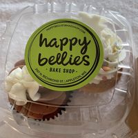 Chocolate and a vanilla cupcake   at Happy Bellies Bake Shop in Appleton