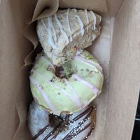 Vegan donuts and scone (from top: funfetti scone, pistachio raspberry donut, espresso donut). at Happy Bellies Bake Shop in Appleton