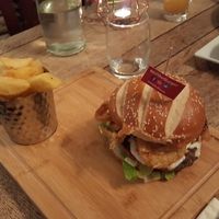  Vegan burger with onion straws, vegan cheese  at The Cyder House Inn in Godalming