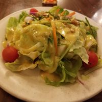 Coronation Salad comes with curry dressing. Not spicy, just flavorful. 
 (Vegan and gluten-free.) at Walt Disney World - Rose & Crown in Lake Buena Vista