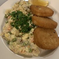 Potato salad with deep fried corn schnitzel meat  at Eaternia in Prague