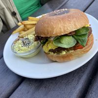 Saturday special- breakfast burger with scrambled tofu, tempeh bacon, rosti and radish.   at Eaternia in Prague
