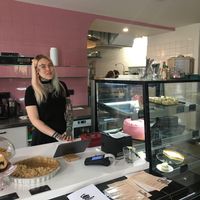 A member of the friendly staff with cool tattoos at Eaternia in Prague