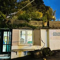 Outside, has some bench seating to the front and left side   at Muhudo Falafel Shop in Tbilisi