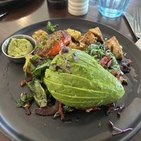 Tofu scramble - pesto and avocado with hash browned potato underneath!   at Ajuna Eatery in Napier