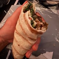 Half eaten Mediterranean wrap. Still quite a bit left!  at DTW - Plum Market in Romulus